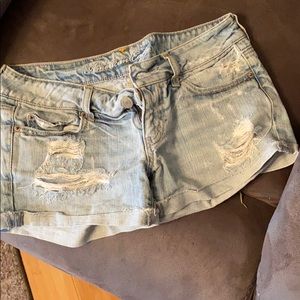 Distressed denim shorts